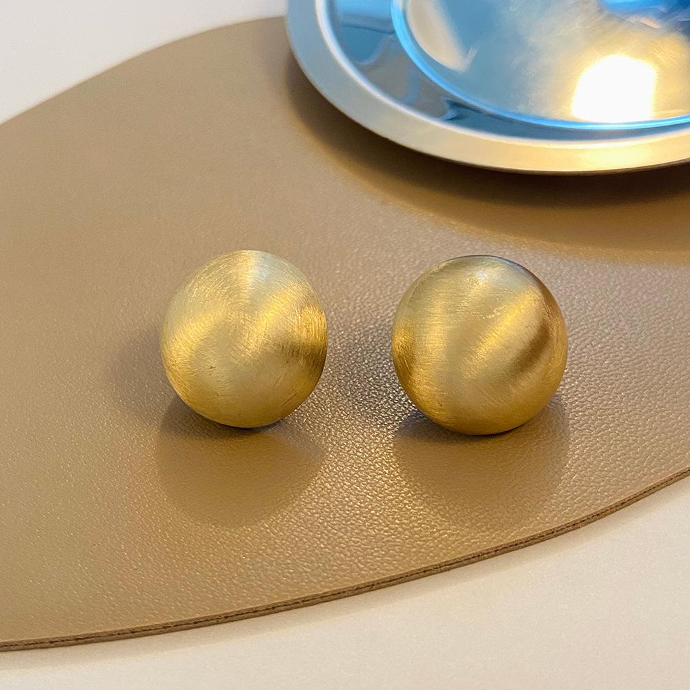 Brushed hemispherical earrings women's French light luxury niche design matte frosted round earrings ins trend