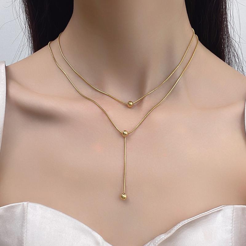 Double-layer stacked tassel necklace female small golden bean double-layer collarbone chain simple titanium steel transfer bead necklace