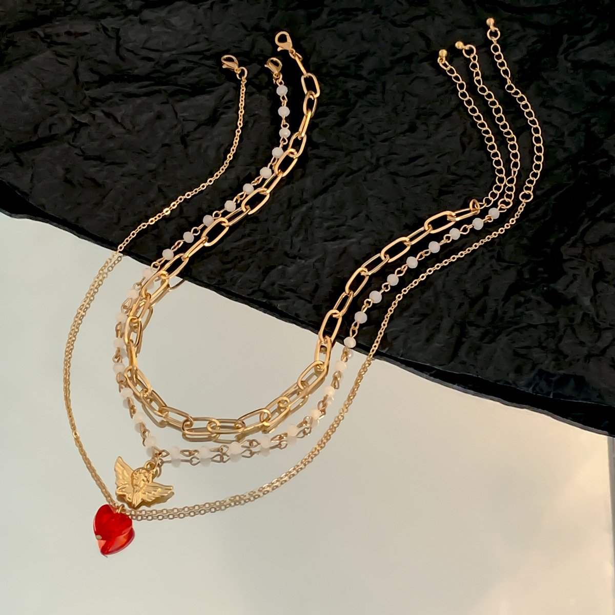 Stacked retro little angel pendant versatile collarbone chain temperament fashion imitation crystal love necklace female