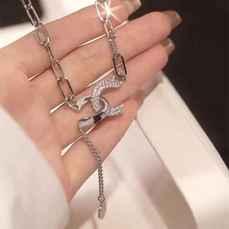 The same autumn and winter all-match cross sweater chain female niche light luxury ins titanium steel adjustable double C necklace