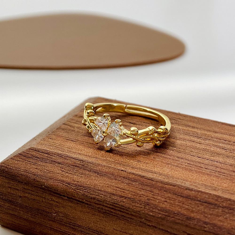 Retro micro-inlaid zircon four-leaf clover ring female fashion personality vine winding adjustable flower index finger ring