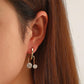 Ins copper inlaid zircon U-shaped geometric earrings French light luxury personality temperament hollow ball earrings earrings