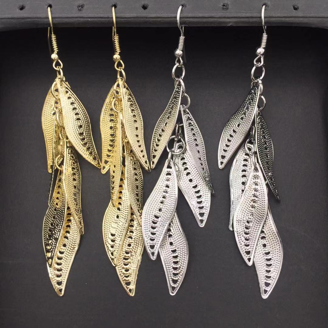 Three-dimensional curved surface hollow wicker tassel female earrings Yunnan minority fashion metal earrings