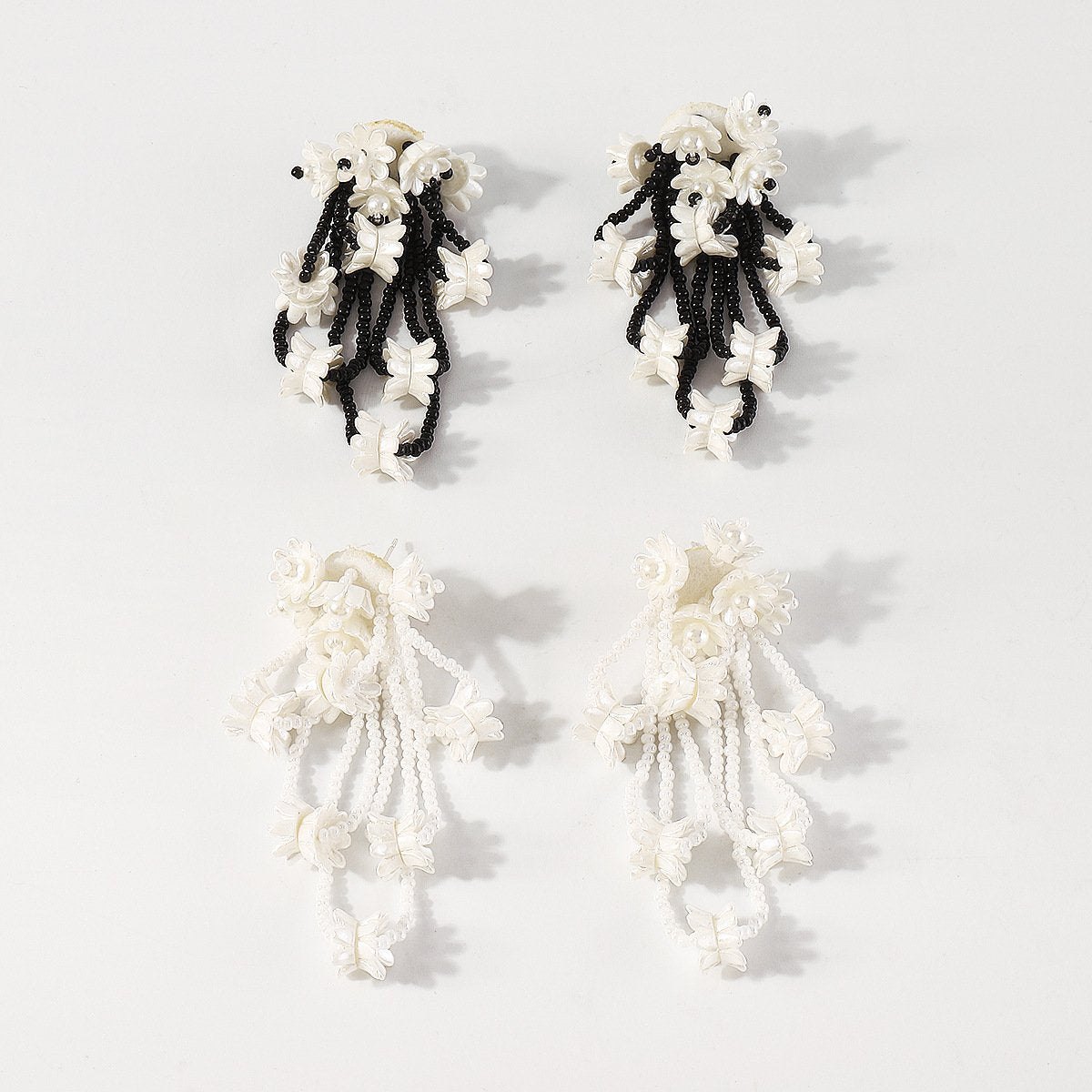 E1994 Creative hand-woven rice bead resin earrings niche design cold flower earrings