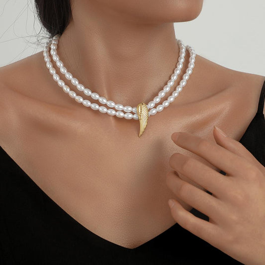 Fashion personality stainless steel angel wings titanium steel pendant simple temperament elegant double pearl necklace female