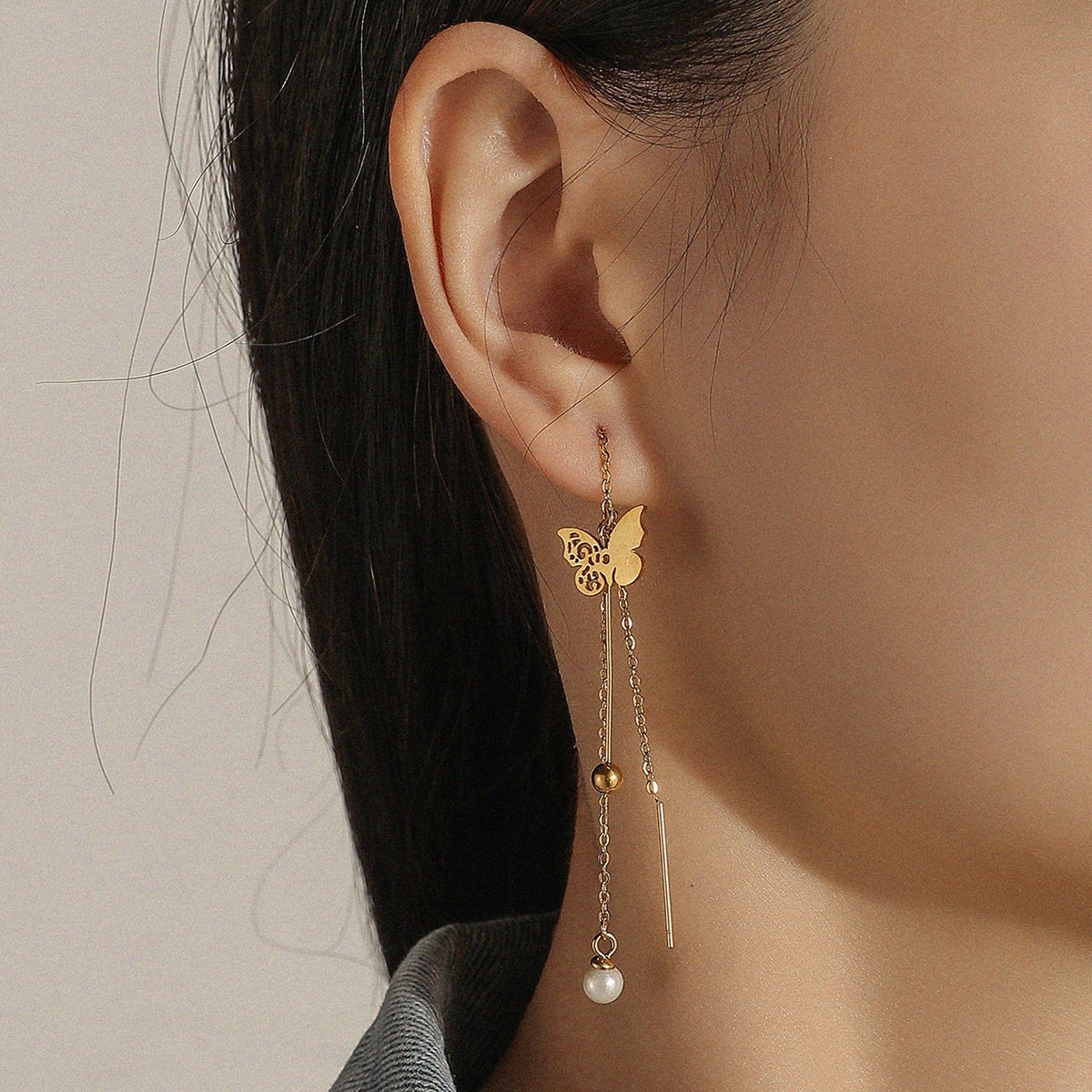 Stainless steel gold-plated color-preserving hollowed-out butterfly pearl ear wire elegant tassel ladies titanium steel gold bead earrings