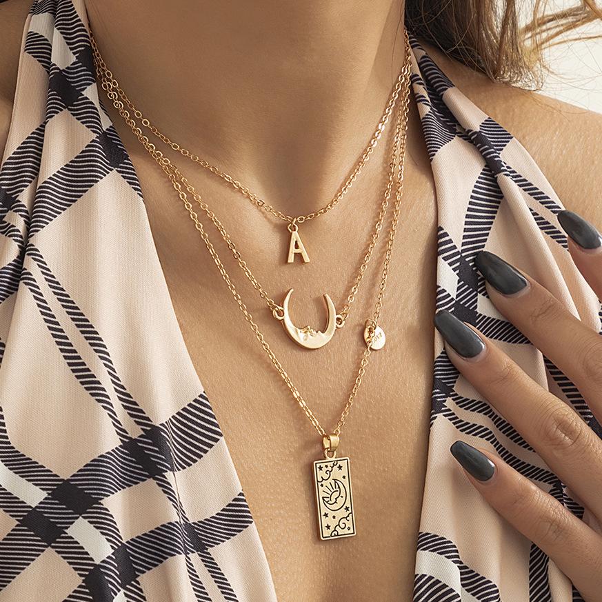 Jewelry stacked hot girl alloy portrait pendant creative star and moon letter tassel multi-layer necklace female