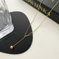 Frosty ins design tassel necklace stitching and pulling small gold ball titanium steel gold-plated clavicle chain