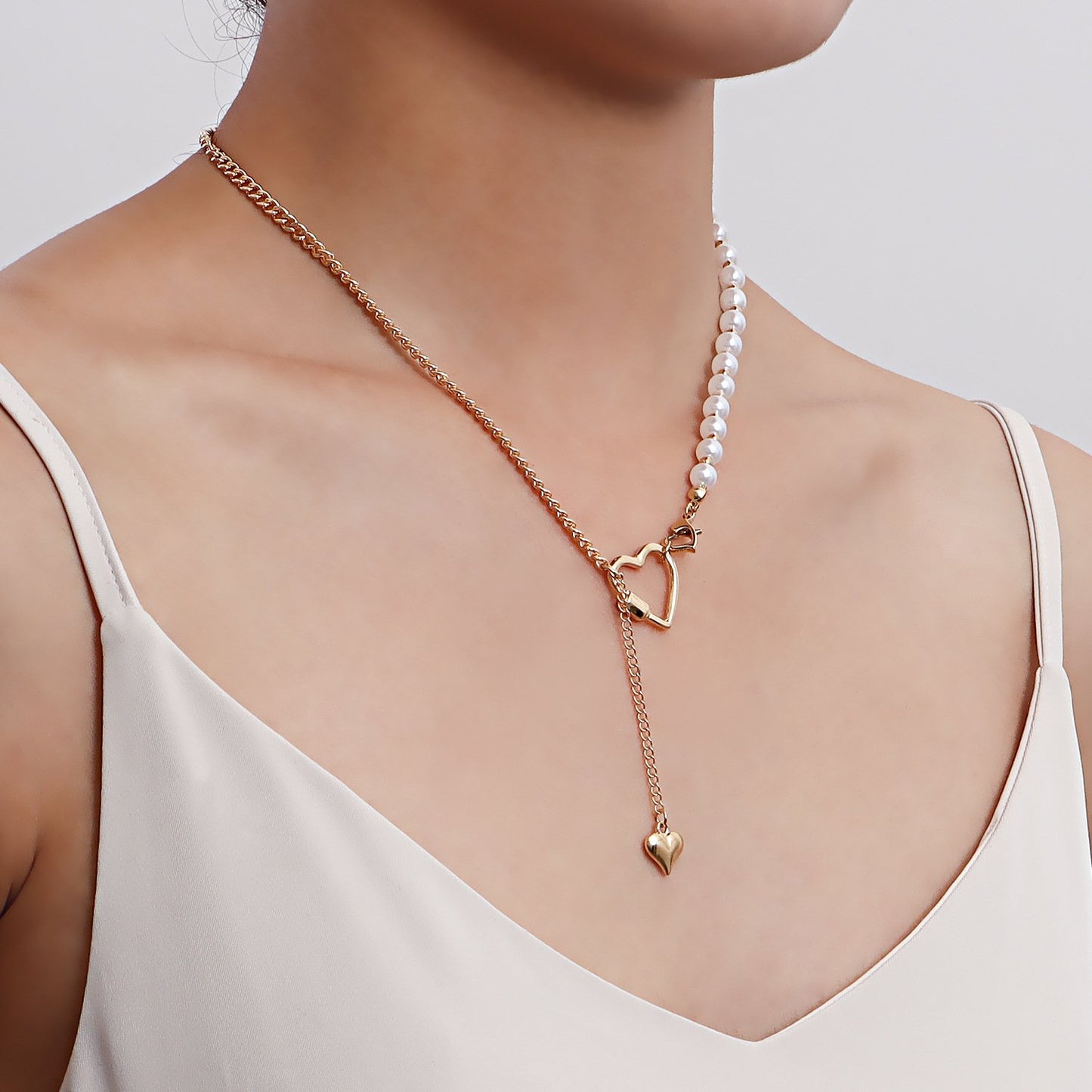 Retro imitation pearl stitching personality clavicle necklace simple geometric heart asymmetrical metal necklace ins