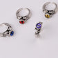 Fashion ring personality male and female models inlaid skull three-dimensional multi-color magic eye personality ring