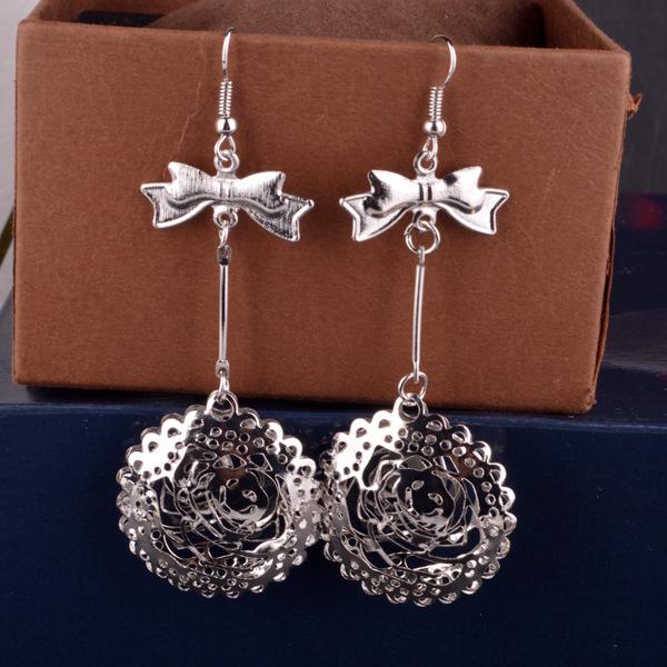 Three-dimensional Hollow Round Body Alloy Earrings Ladies Bow Knot Earrings